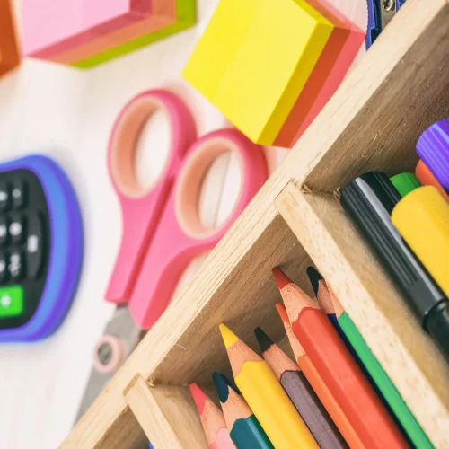 school-supplies-wooden-desk-close-up-view